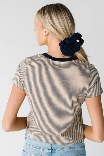 Back view of taupe and black short sleeve tee with contrasting crew neckline