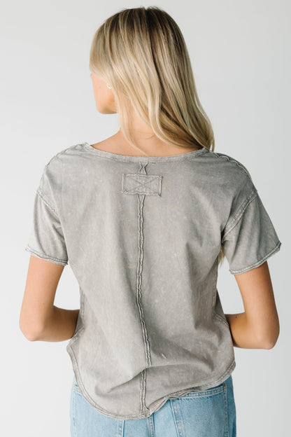 Back view of grey short sleeve tee with seam details