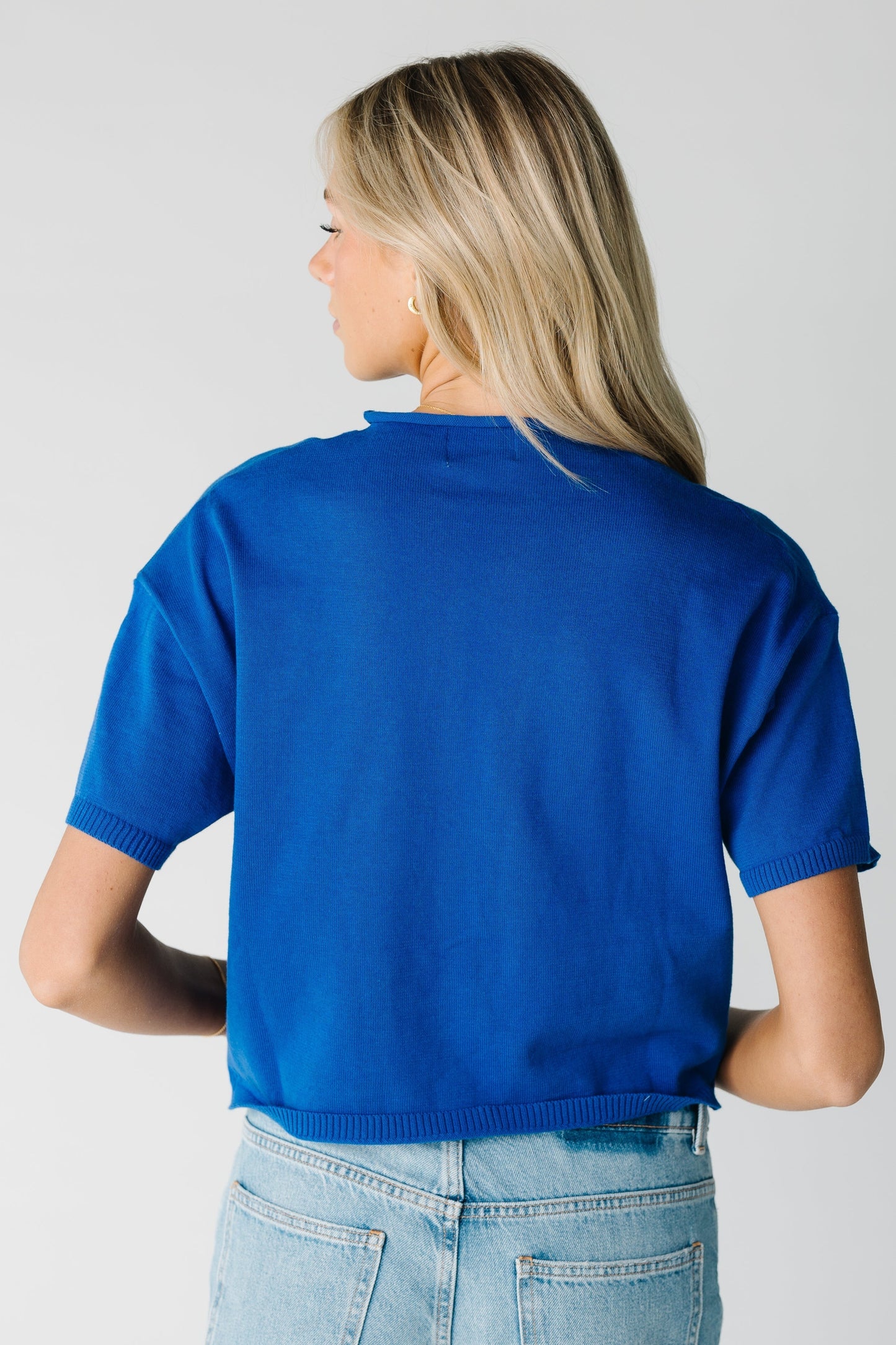 Back view of blue short sleeve top