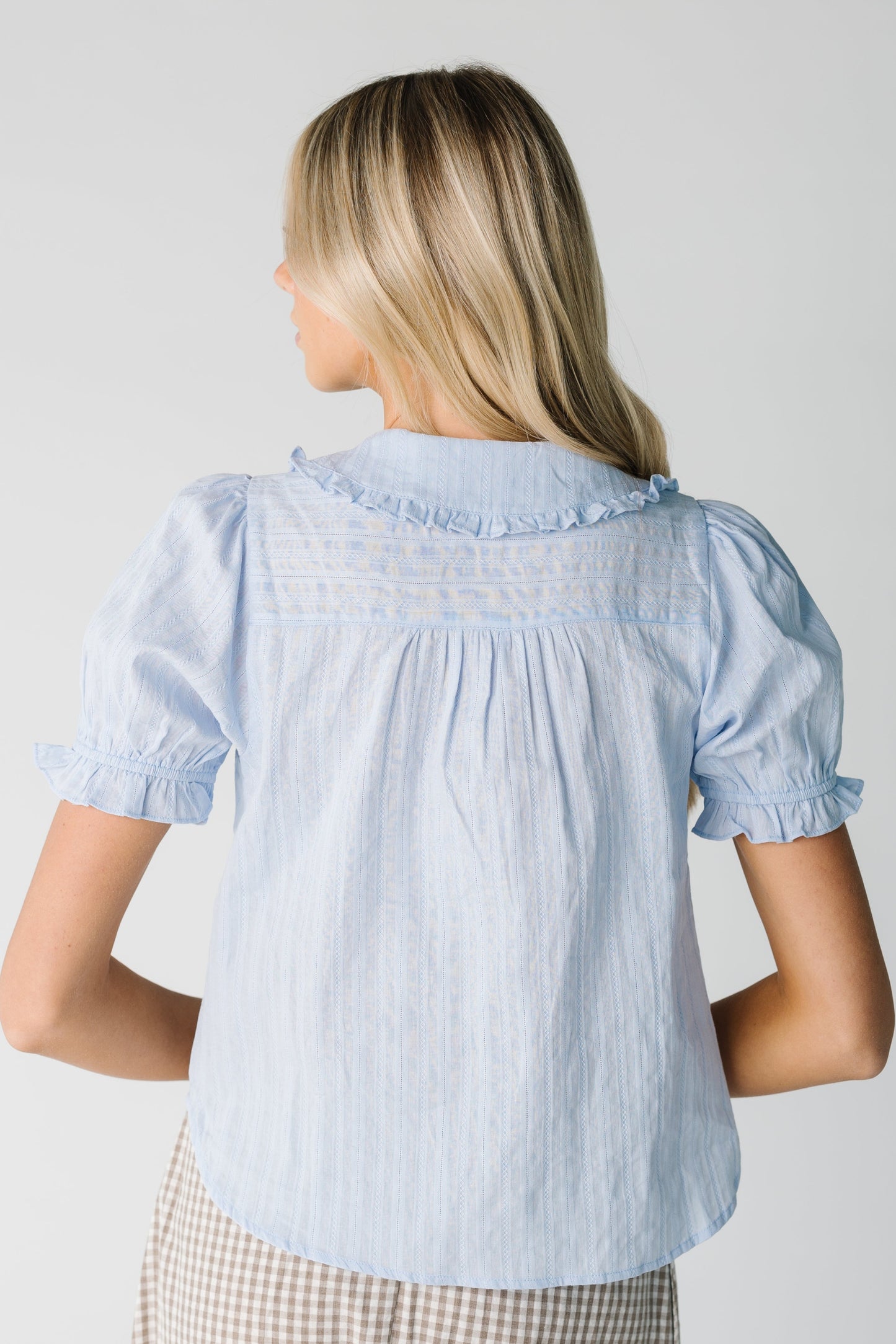 Back view of short sleeve light blue top