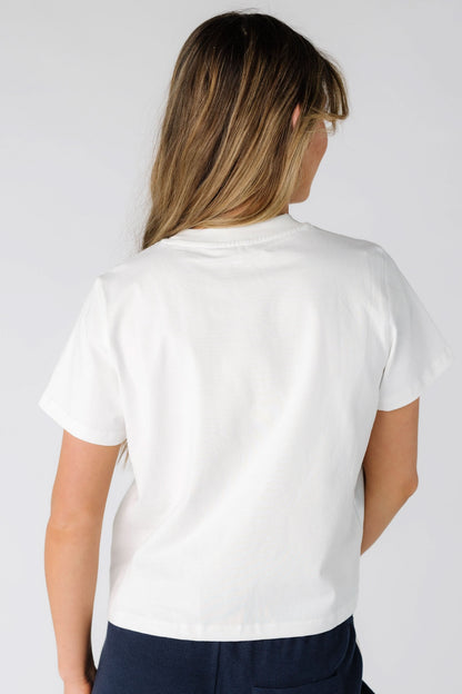 Back view of a young woman wearing a short sleeve tee.