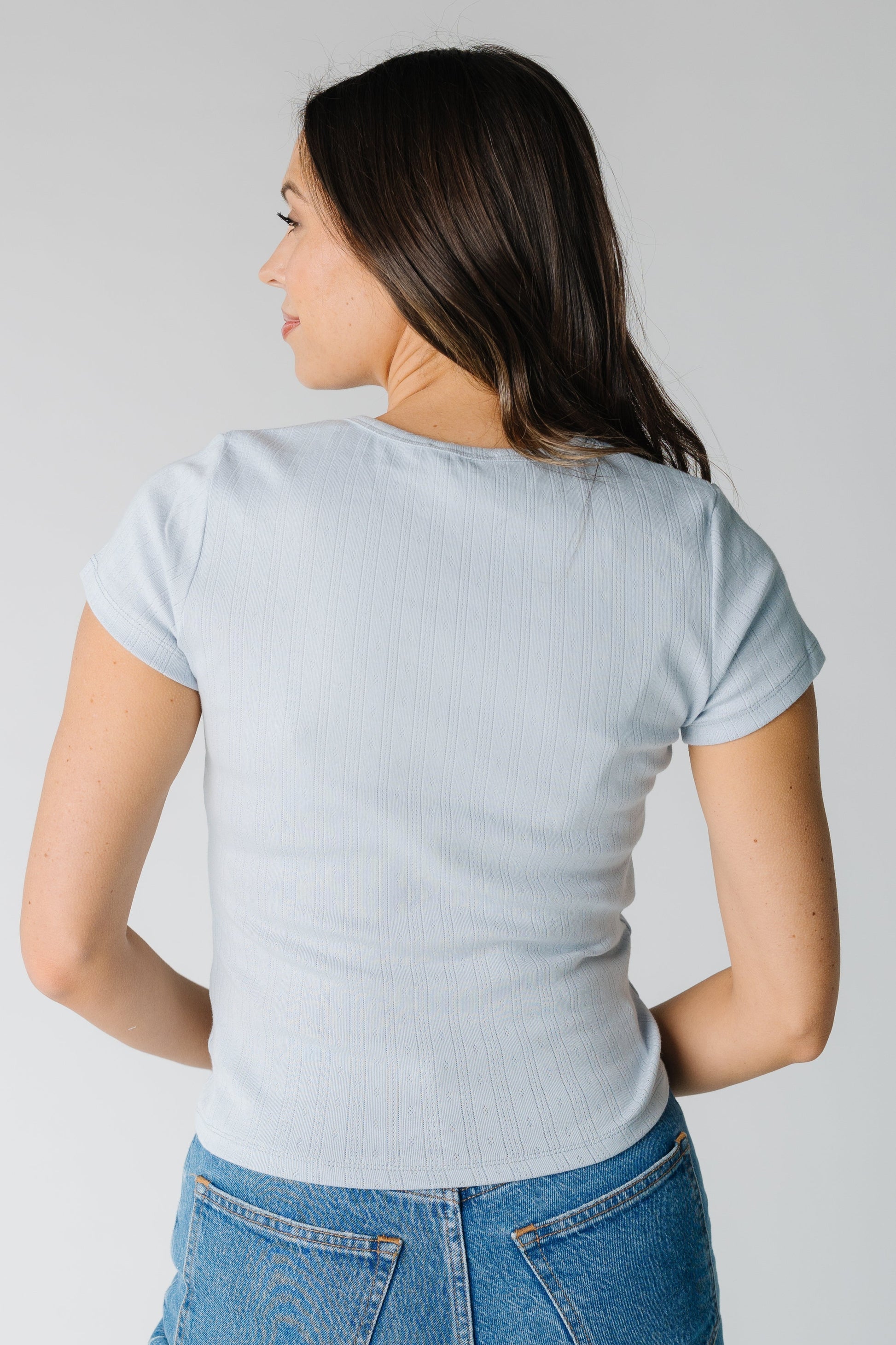 Back view of blue short sleeve pointelle top