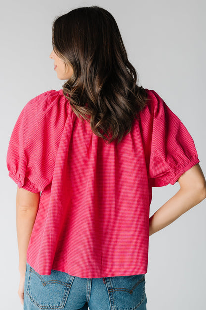 Back view of bright pink loose top in bright pink