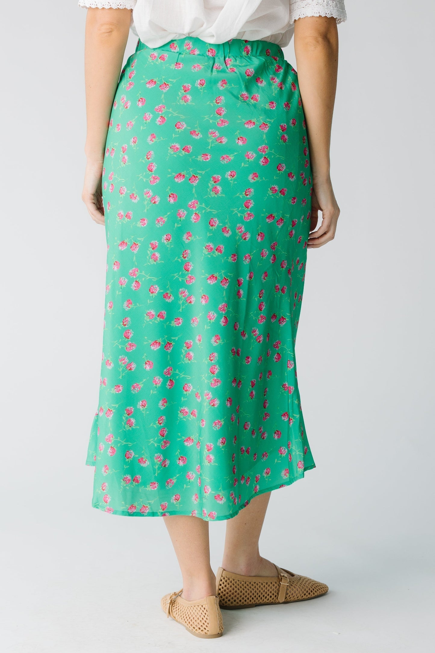 Back view of green and pink floral print A-line midi skirt