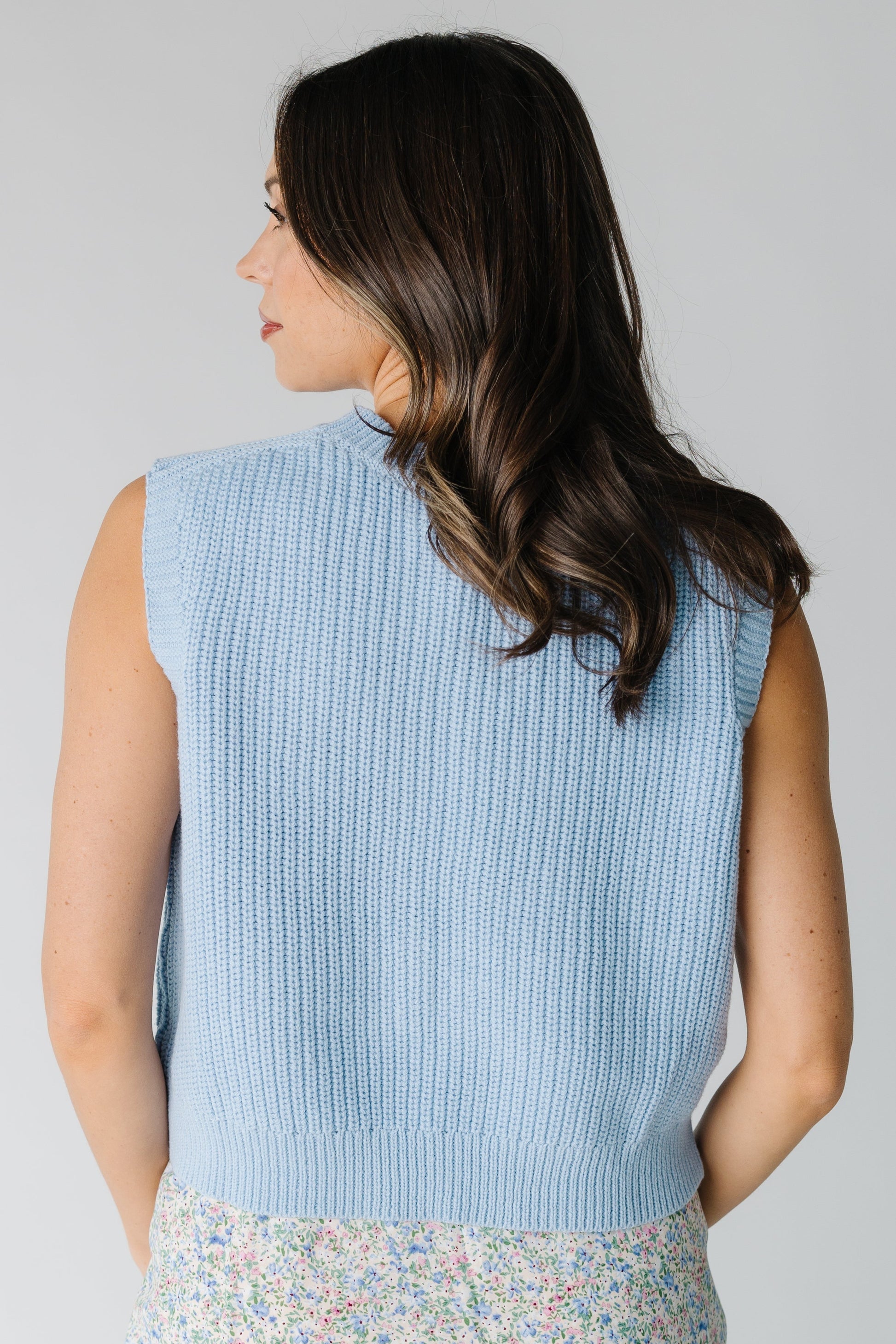 Back view of light blue sweater vest