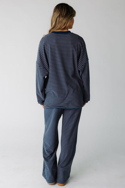 Back view of a woman wearing a loose, lounge set  with long sleeves.