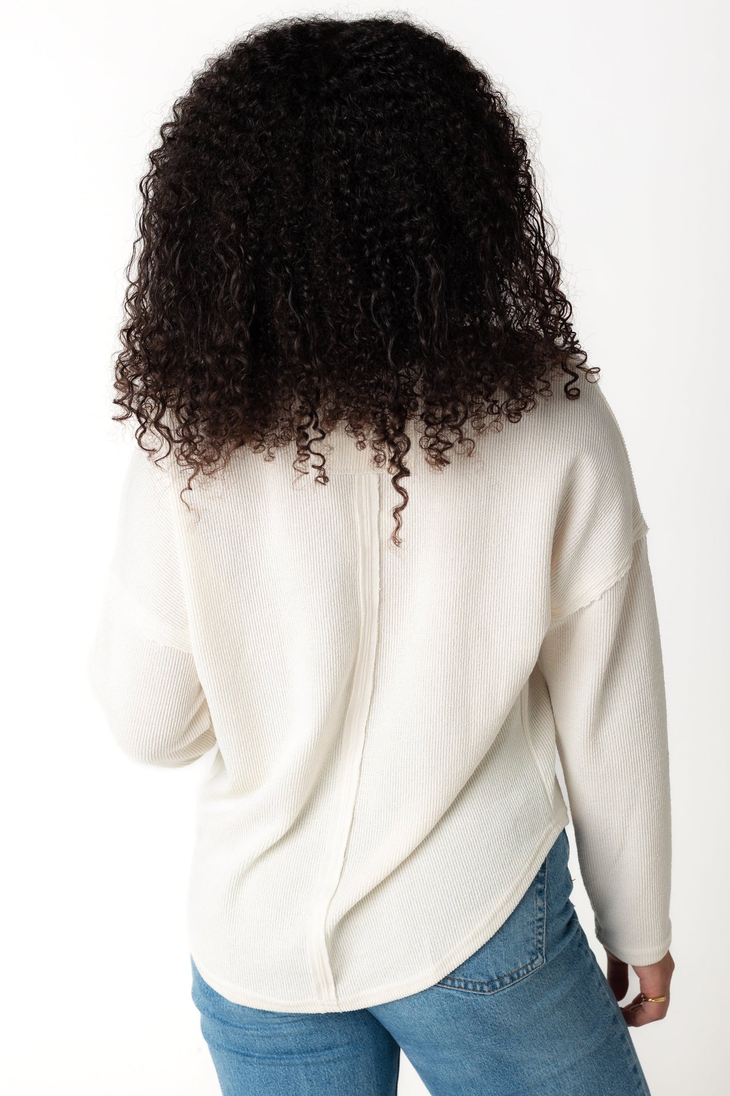 Back view of long sleeve cream sweater