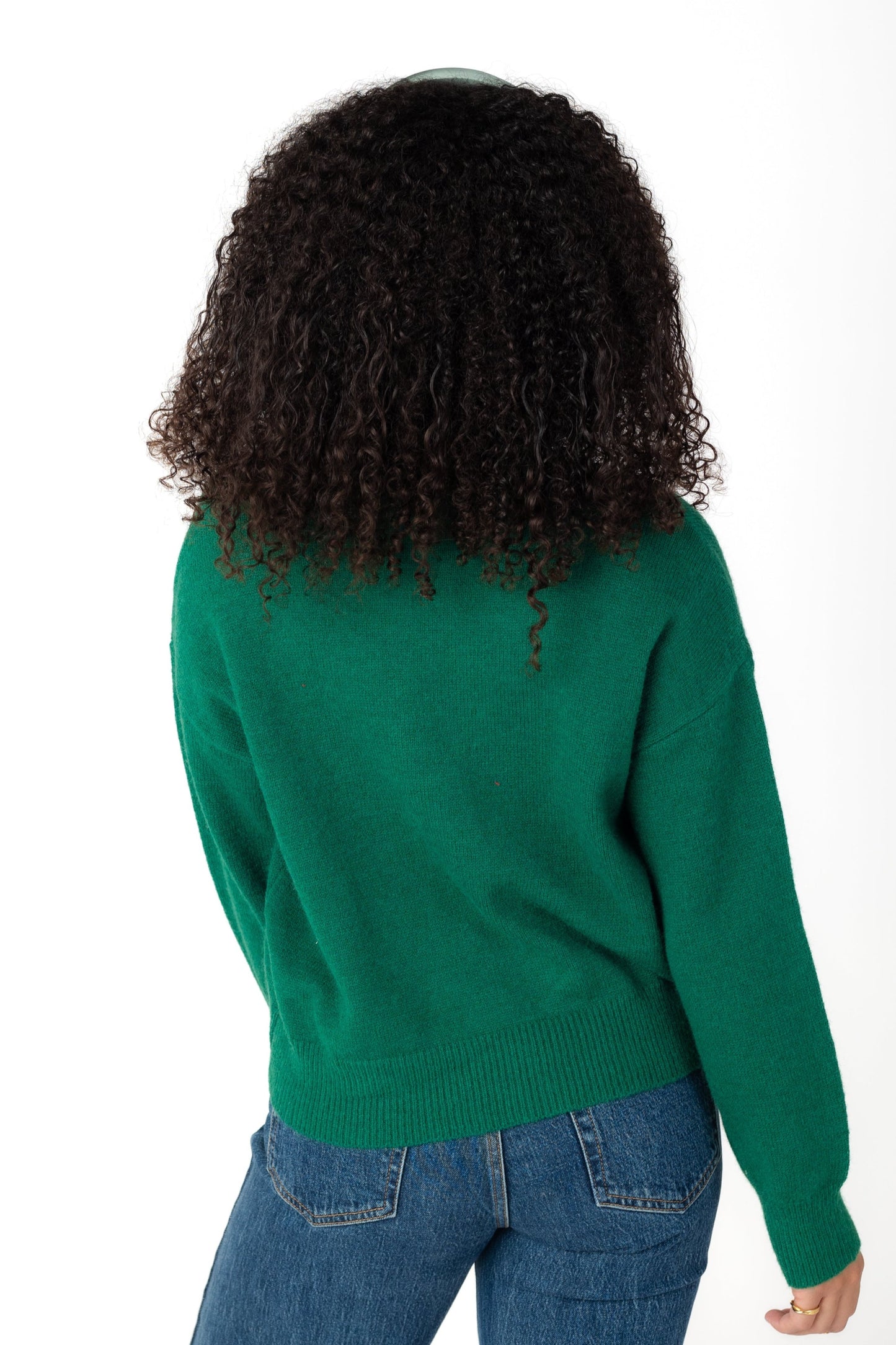 Back view of green long sleeve sweater