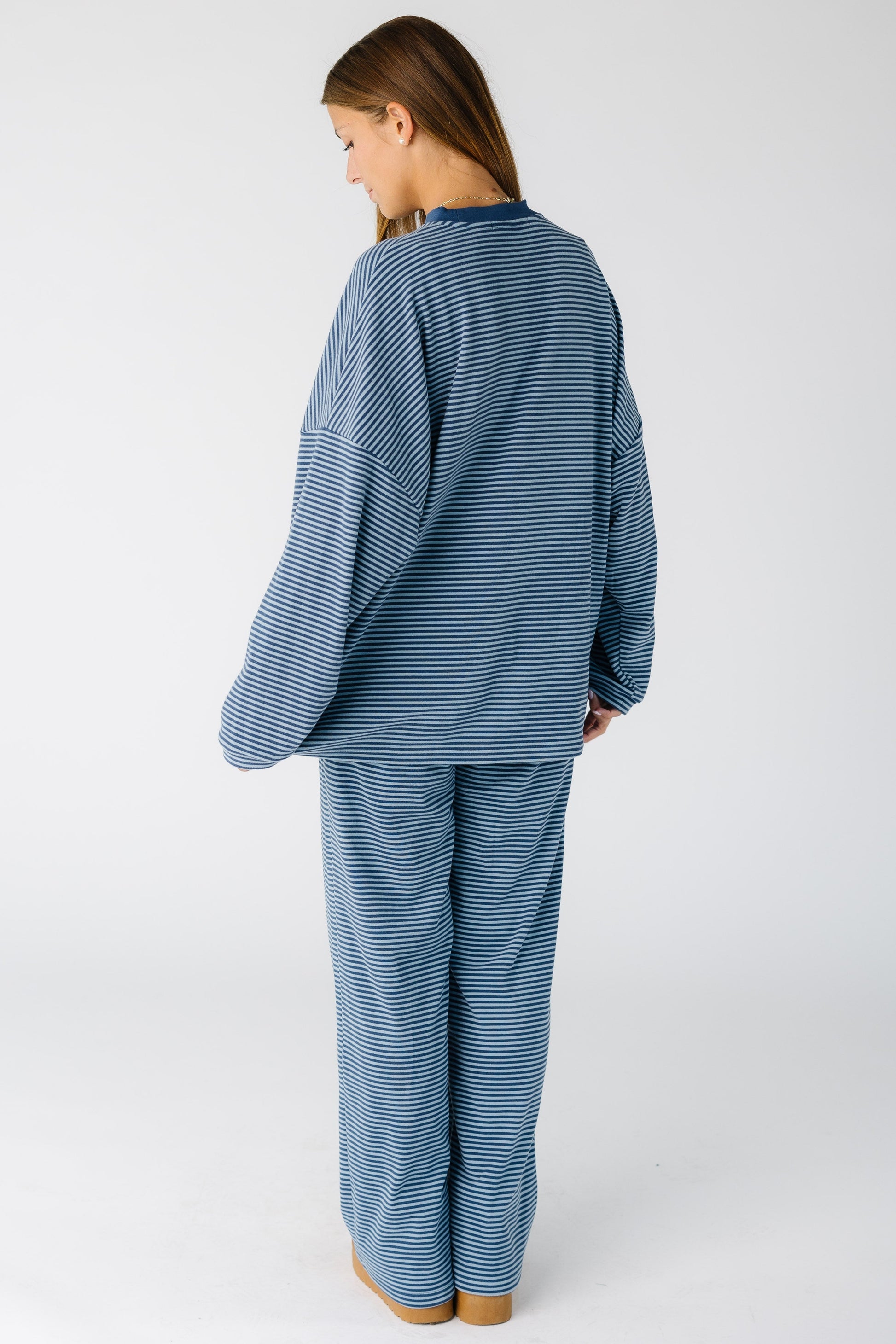 Back view of a woman wearing a blue stripe lounge set