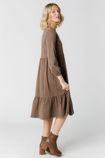 Side view of  brown midi dress with long sleeves