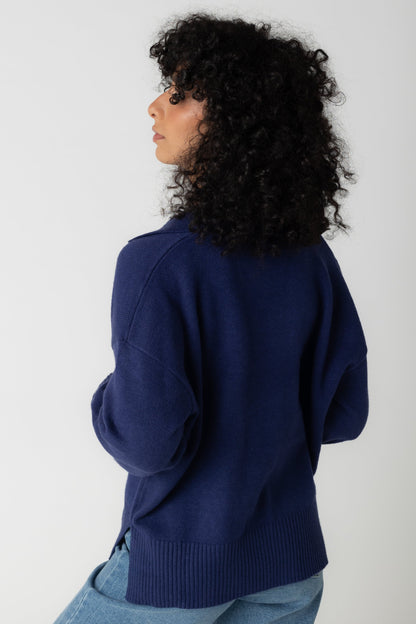 Back view of navy long sleeve sweater