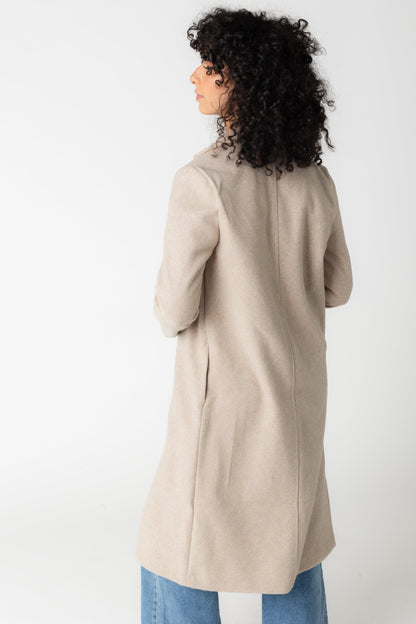 Back view of oatmeal dressy coat with pockets