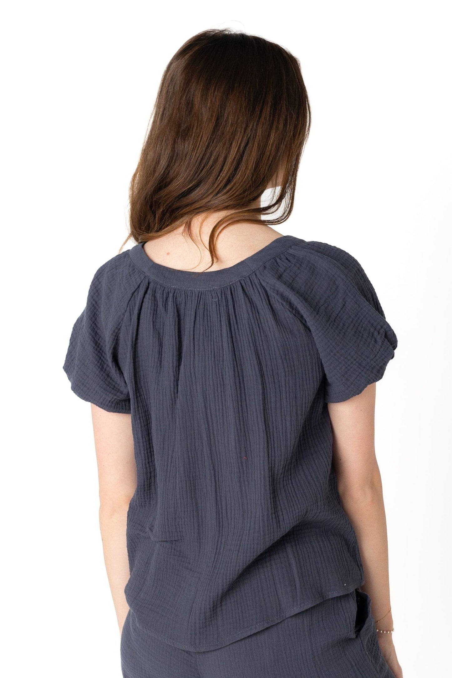 Back view of charcoal scoop neck top with short puff sleeves