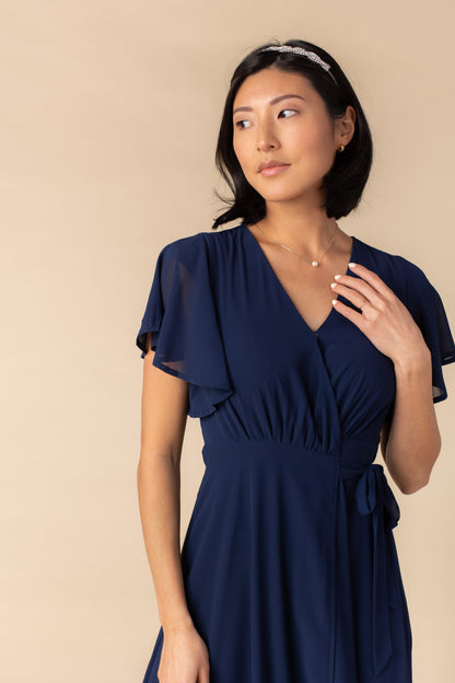 Close view of navy flutter sleeve bridesmaid dress