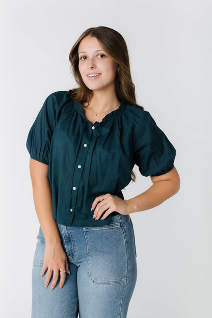 Modest button down top in teal