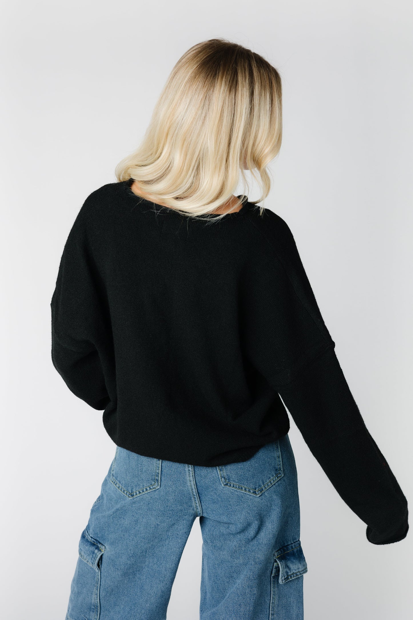 Back view of black long sleeve cardigan