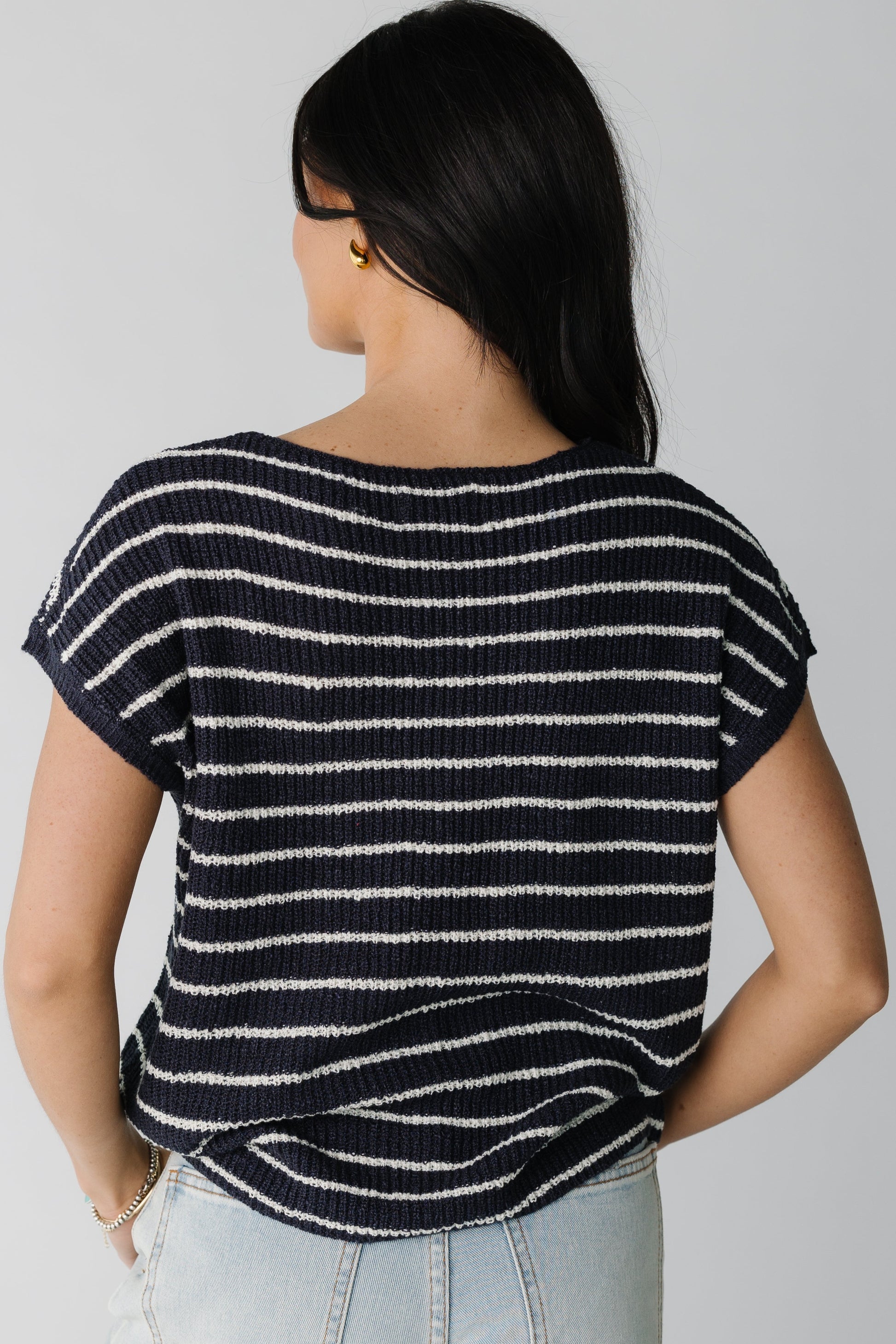 Back view of navy top with white stripes