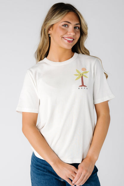 Woman wearing a modest white graphic tee with a crew neckline and a short sleeves.