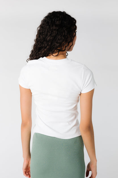 Back view of white closer fitting tee 