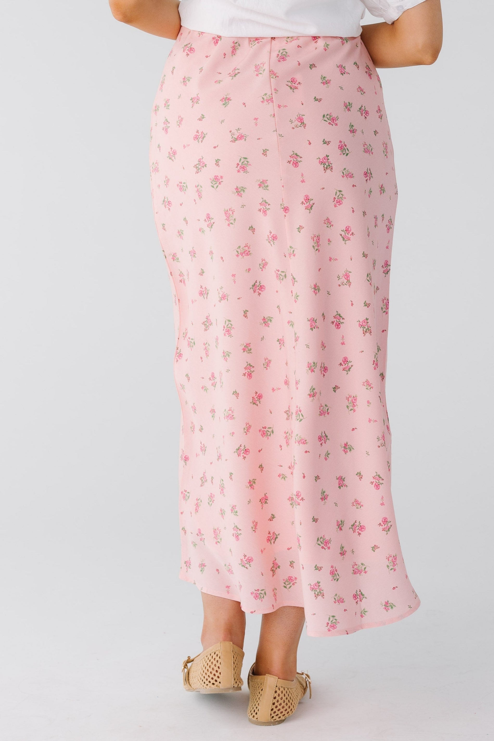 Back view of pink floral A-line midi