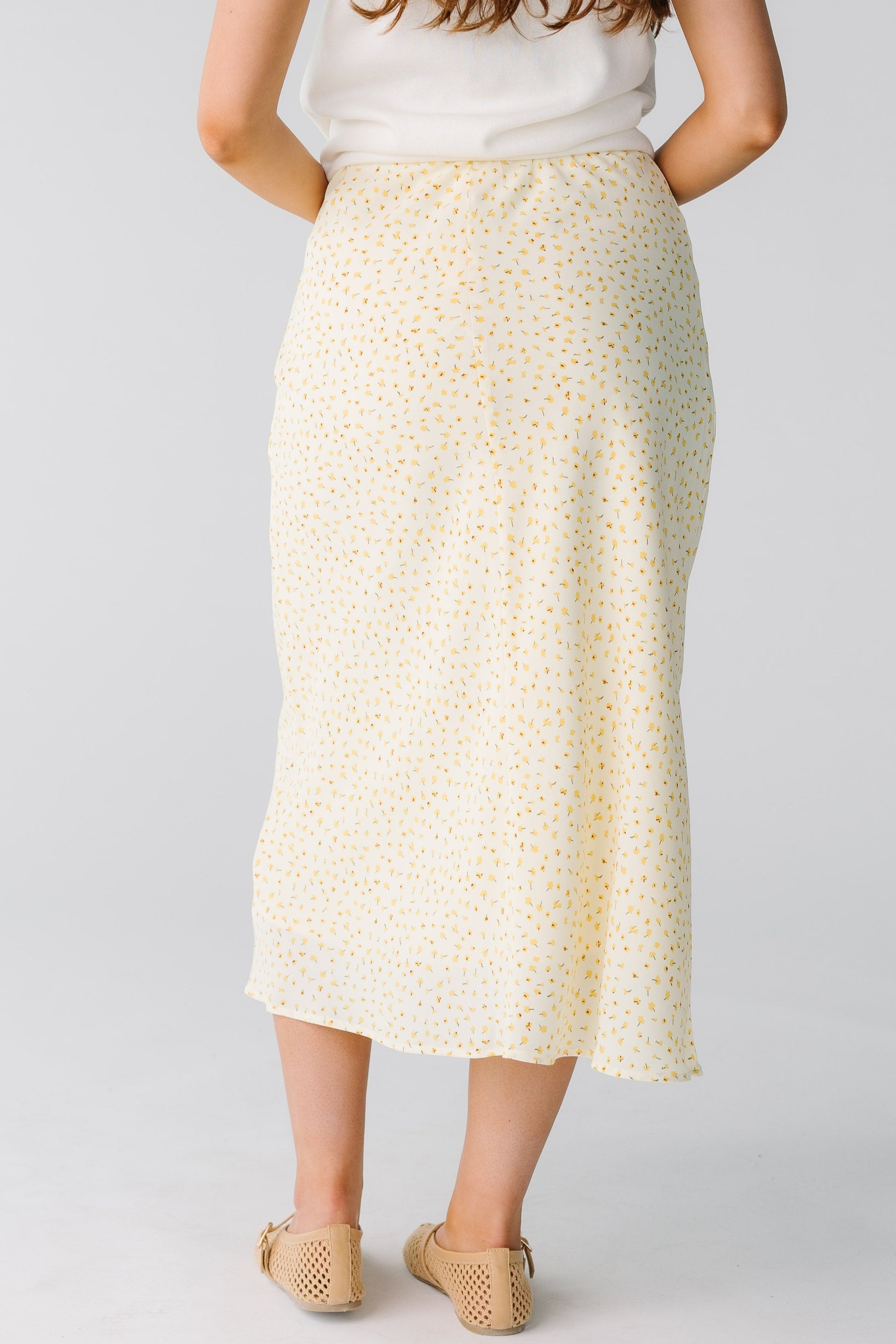 Back view of yellow floral midi skirt