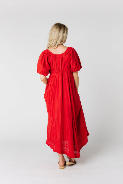 Back view of red textured midi dress