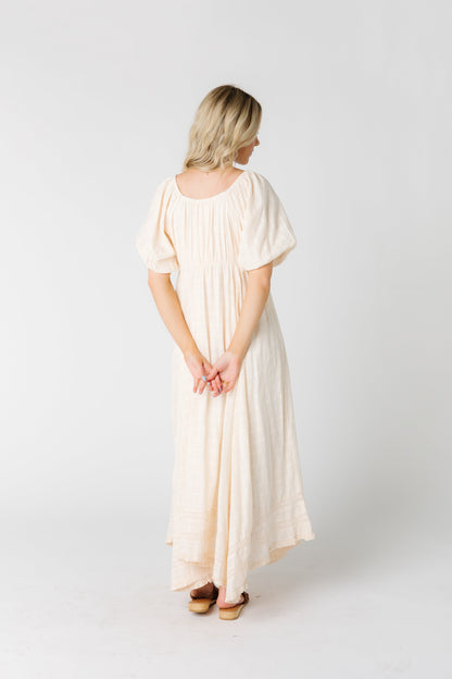 Back view of modest midi dress in cream