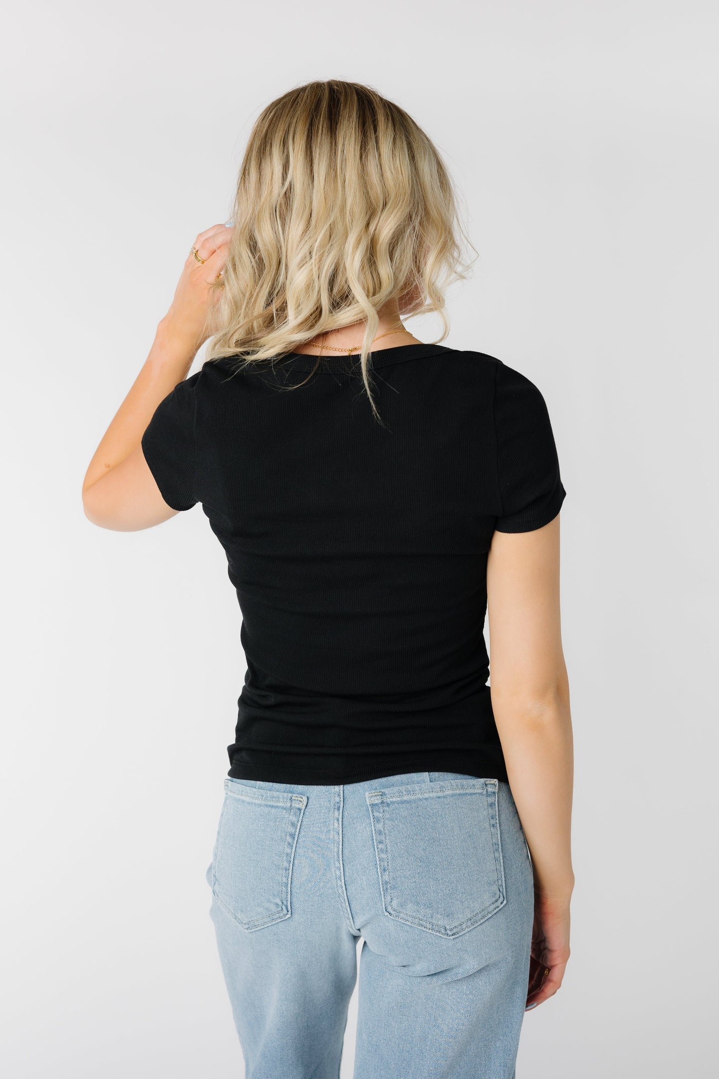 back view of modest close fitting black top