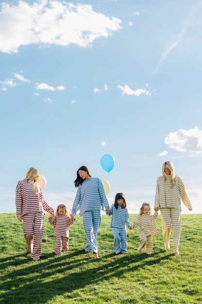 Women and little girls in matching loose fitting lounge sets. 