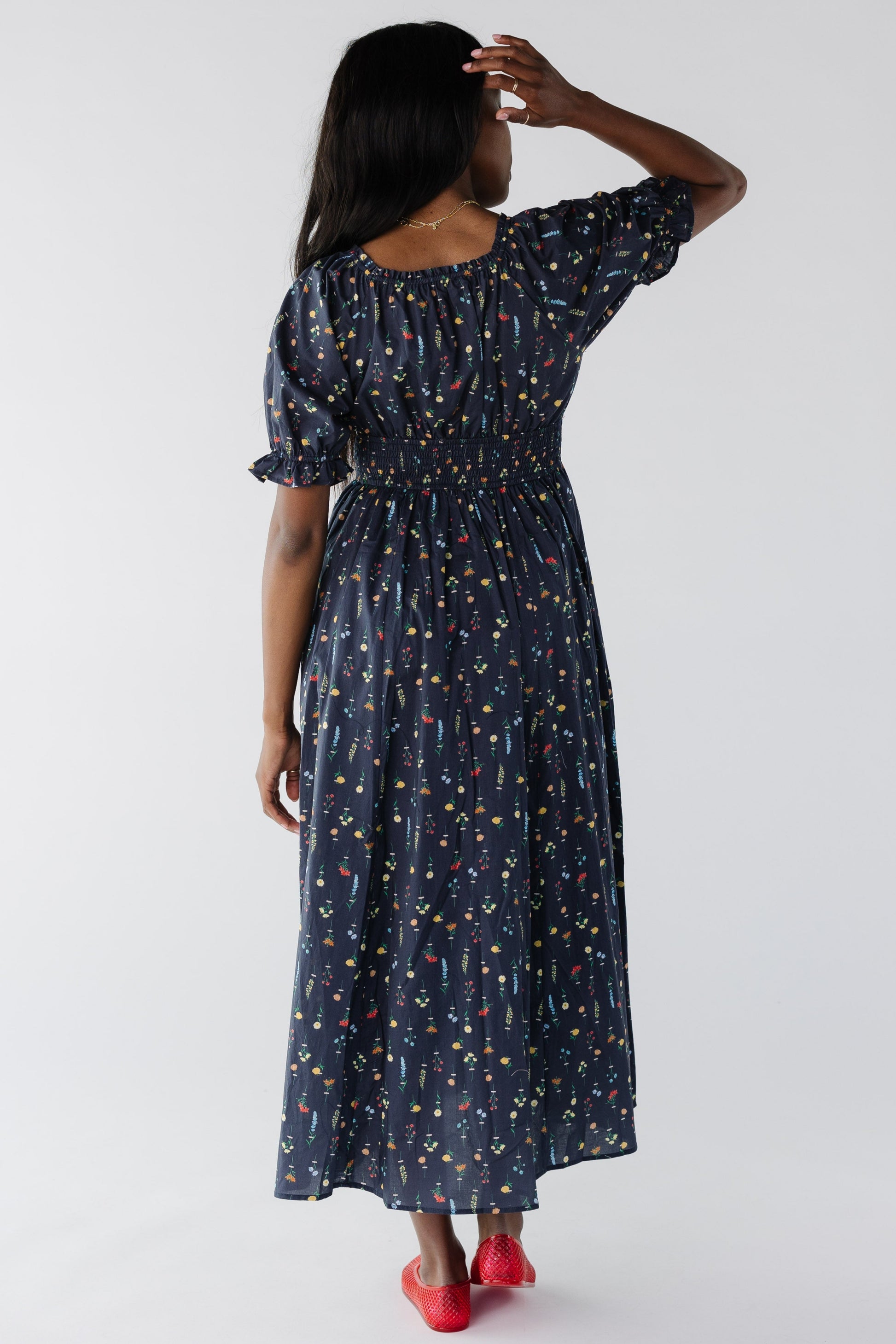 Back view of navy floral midi