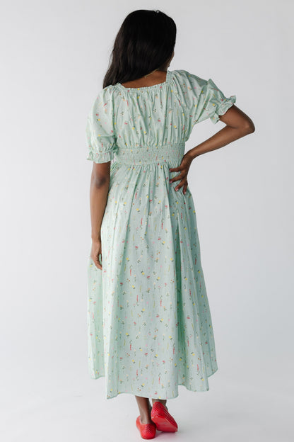 Back view of mint floral midi with short sleeves