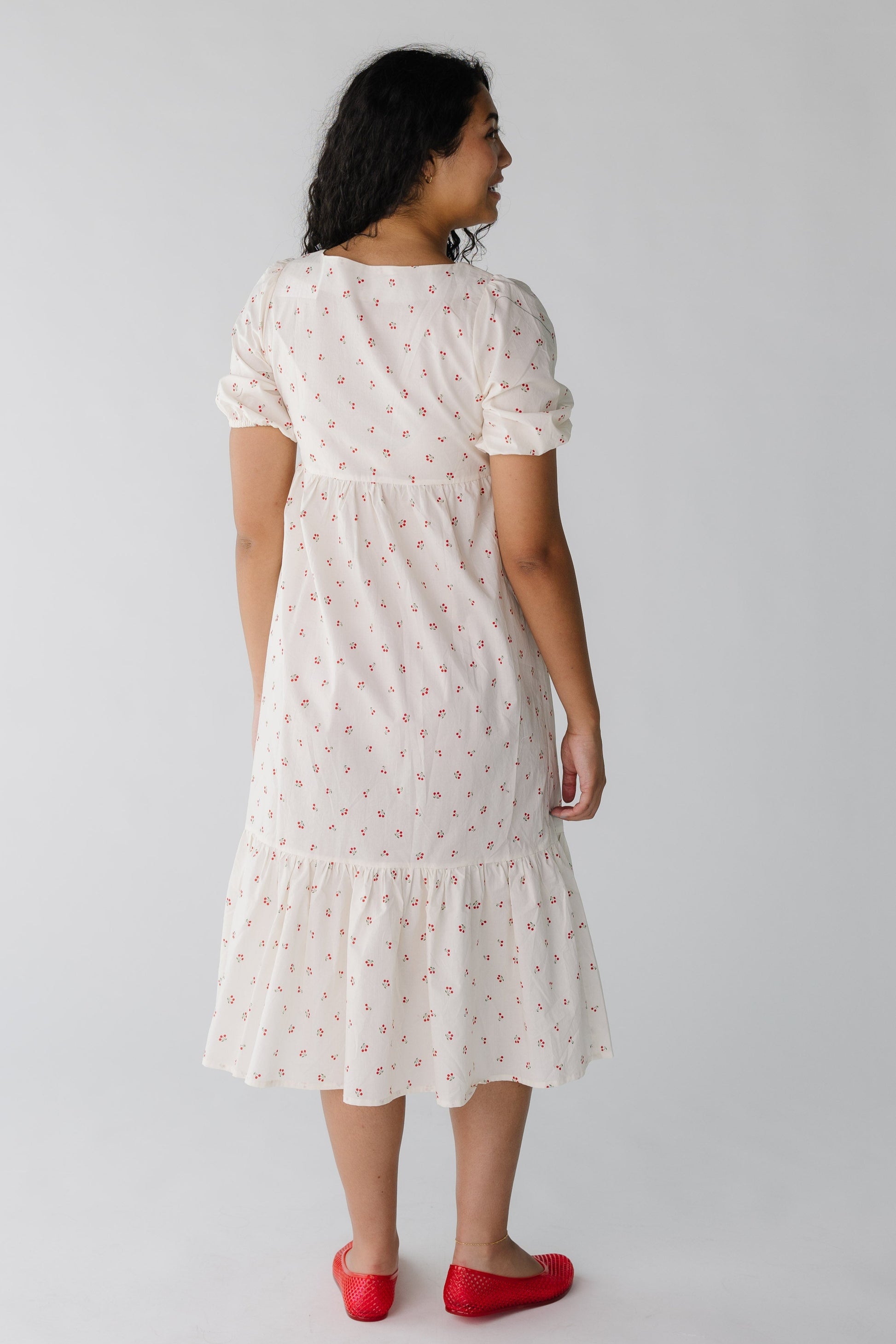 Back view of ivory cherry print midi with short sleeves