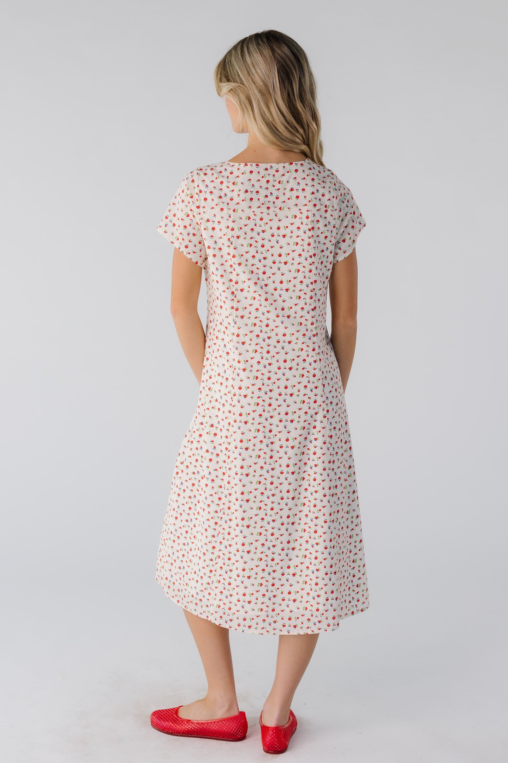 Back view of cream print midi with short sleeves