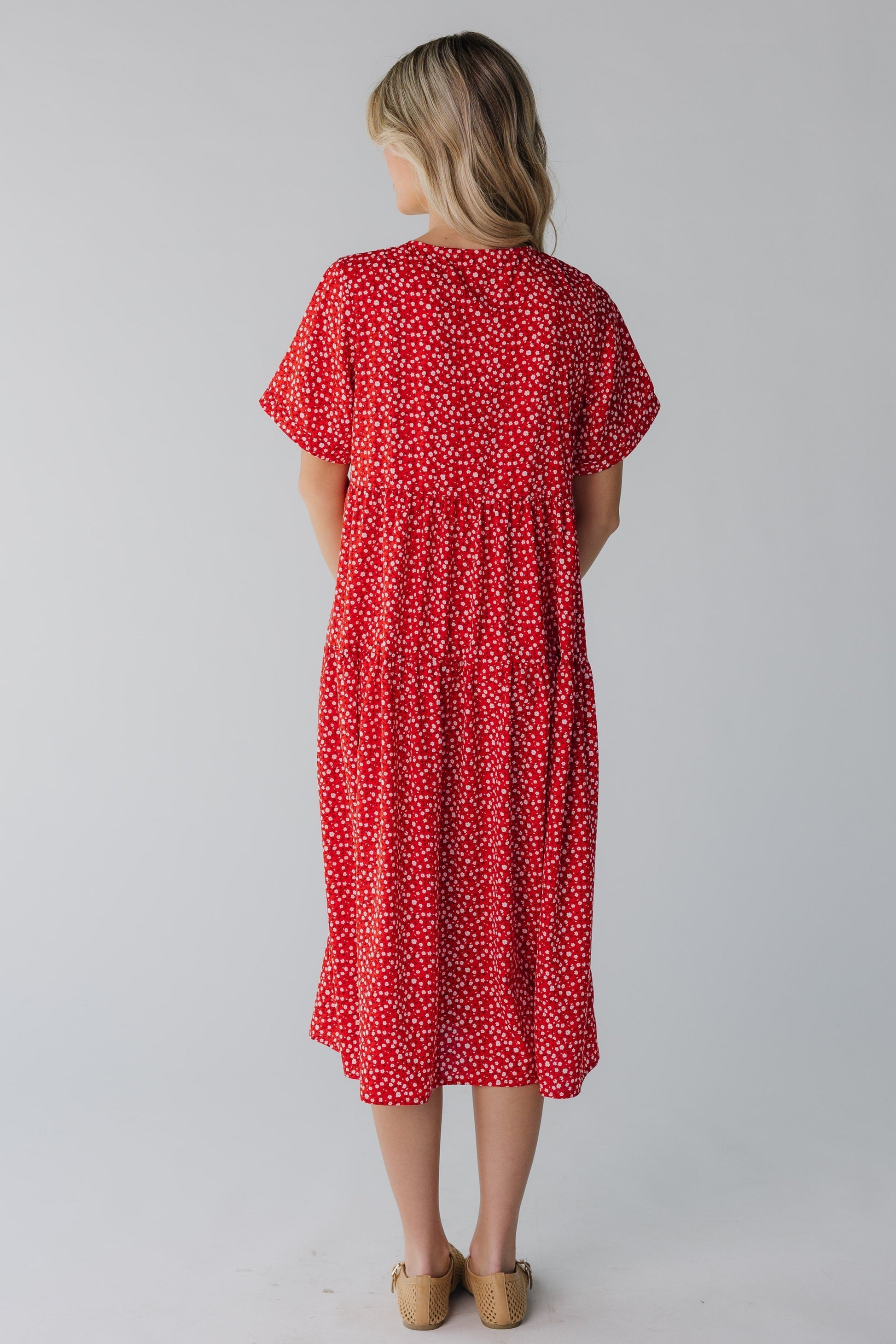 Back view of red floral midi with short sleeves