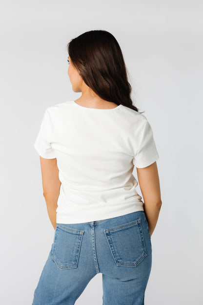 Back view of slightly loose fitting white tee