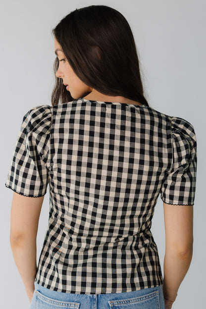 Back view of black and cream short sleeve top