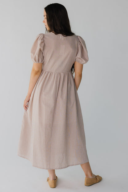 Back view of brown gingham midi dress with short puff sleeves