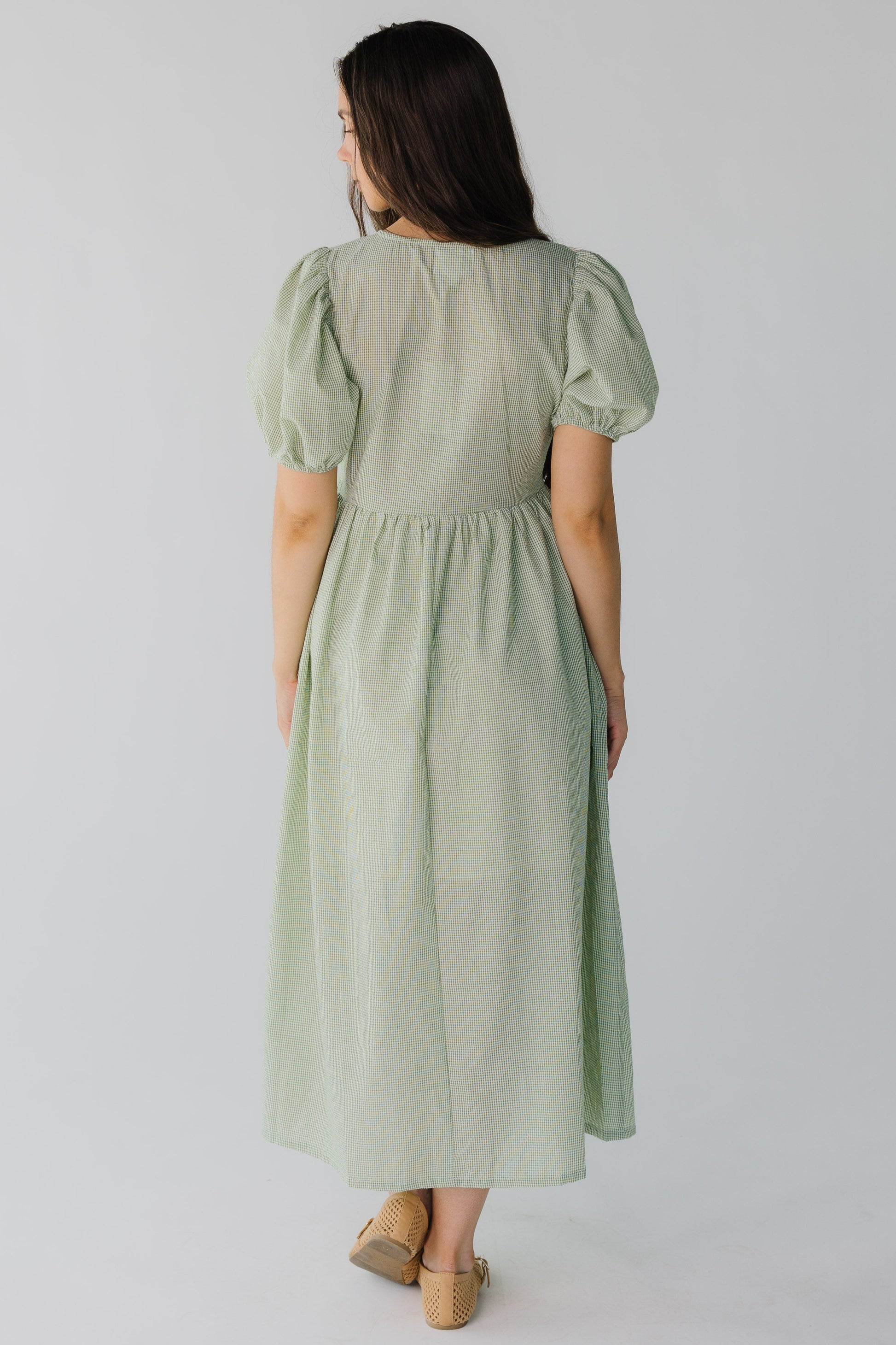 Back view of green gingham dress with short sleeves