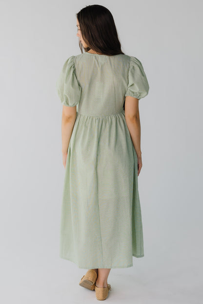 Back view of green gingham dress with short sleeves
