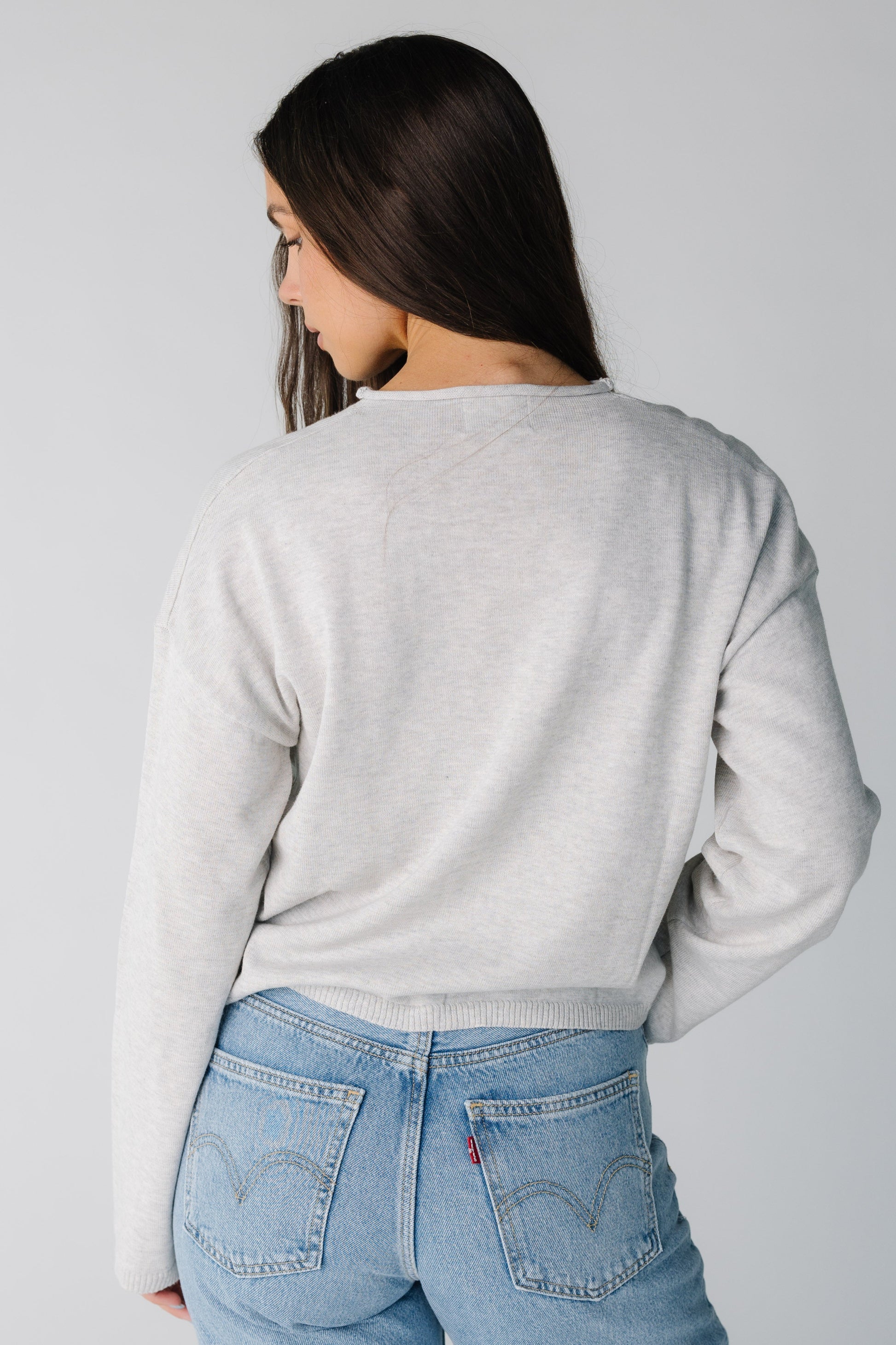 Back view heather grey sweater with long sleeves