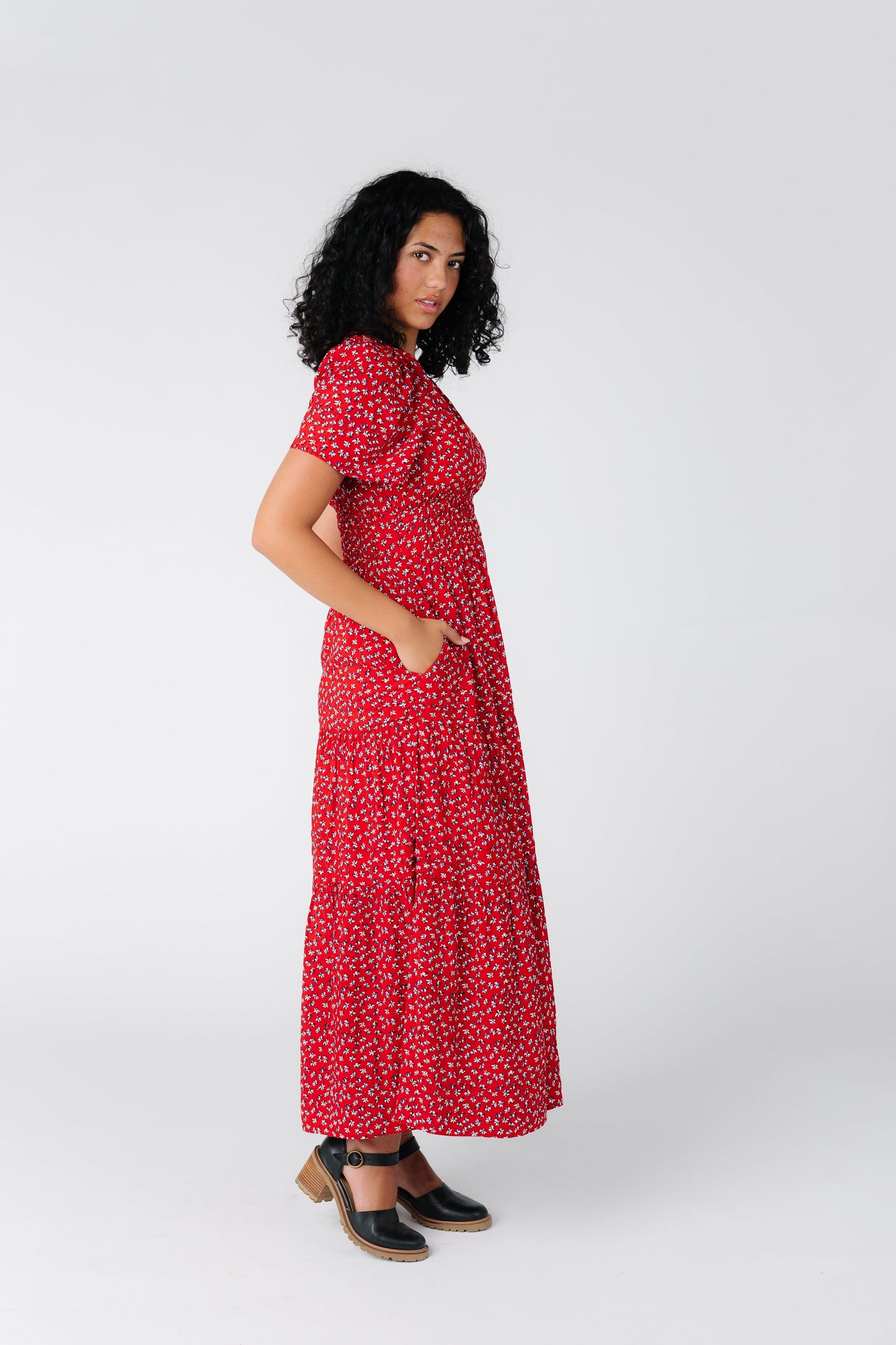 Side view of red print floral midi dress