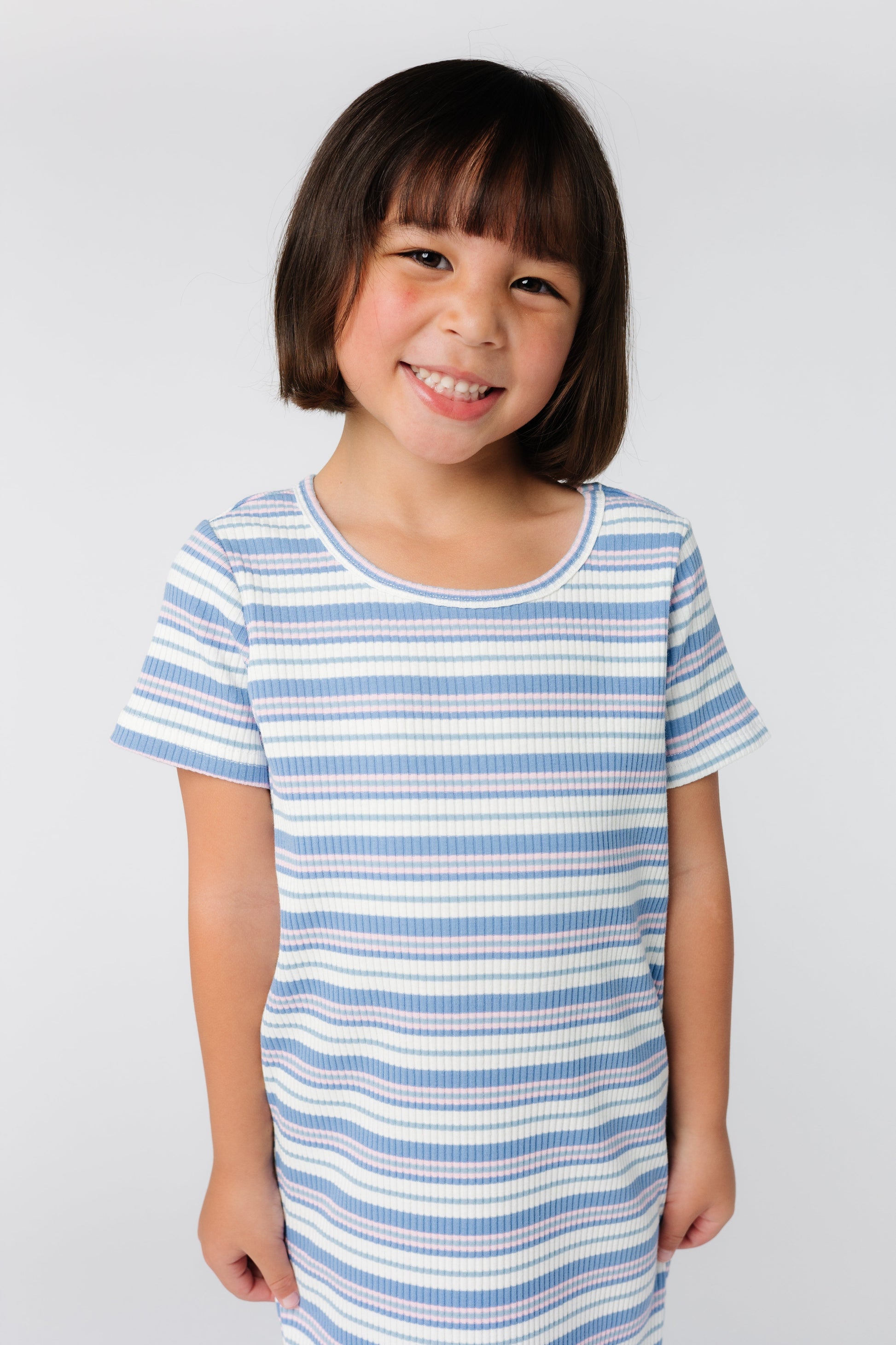 Close up front view of girl's stripe t-shirt dress with short sleeves and round neckline