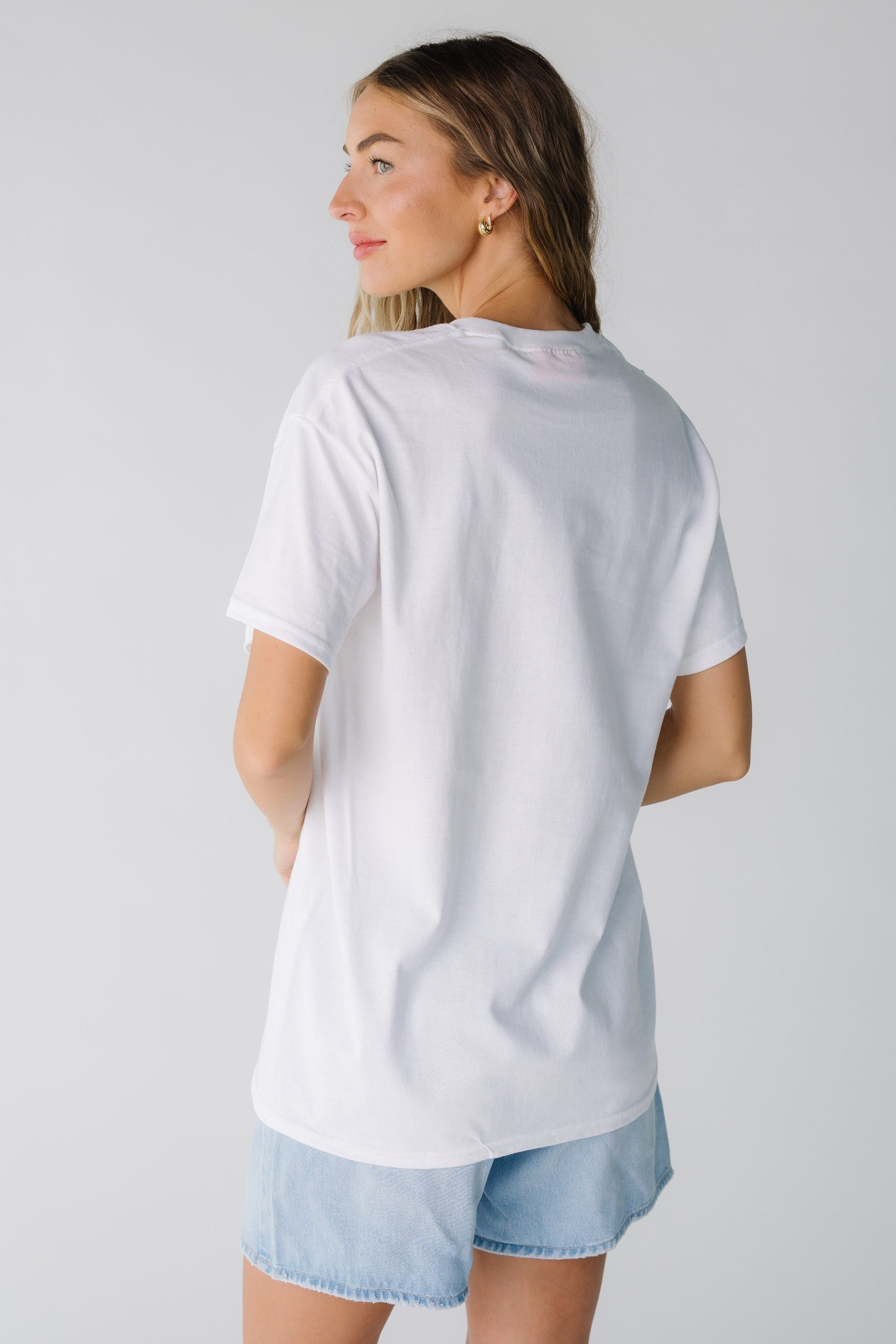 Back view of white loose tee