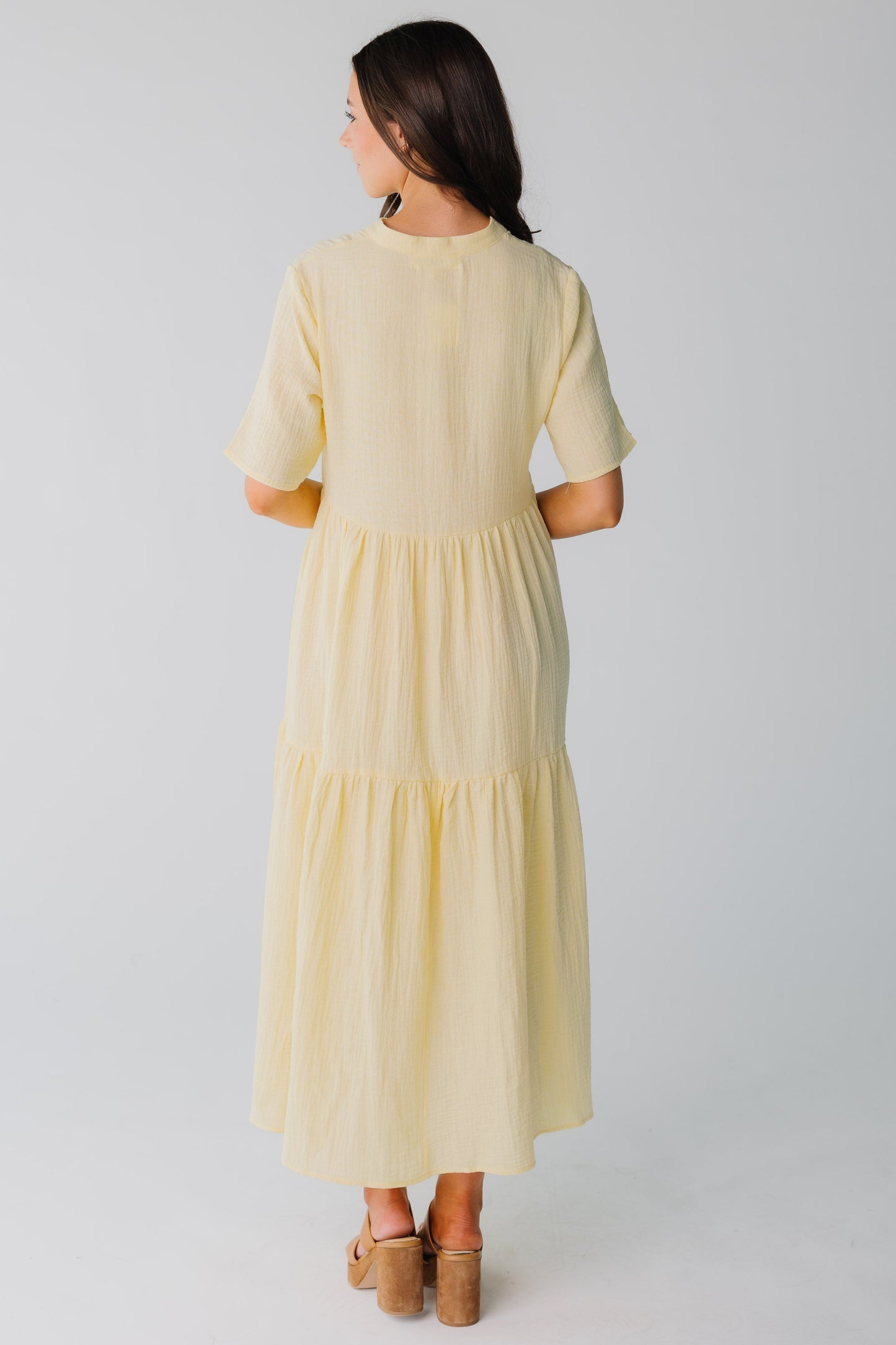 Back view of light yellow midi dress with short sleeves for women