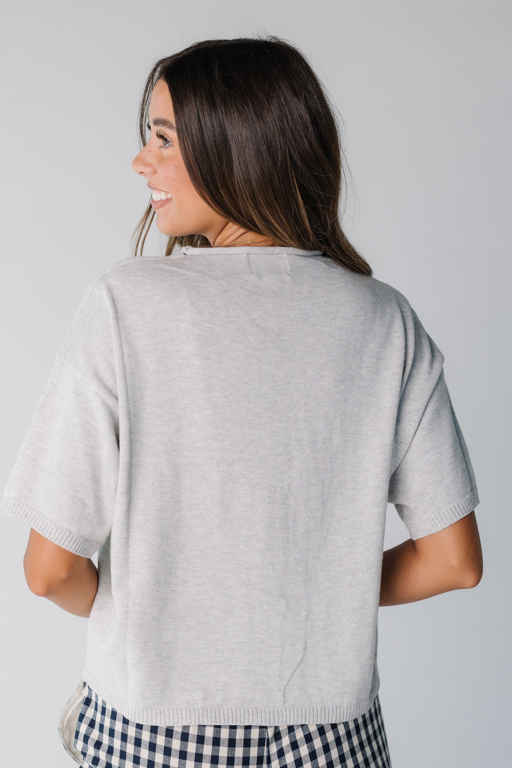 Back view of women short sleeve knit top in heather grey
