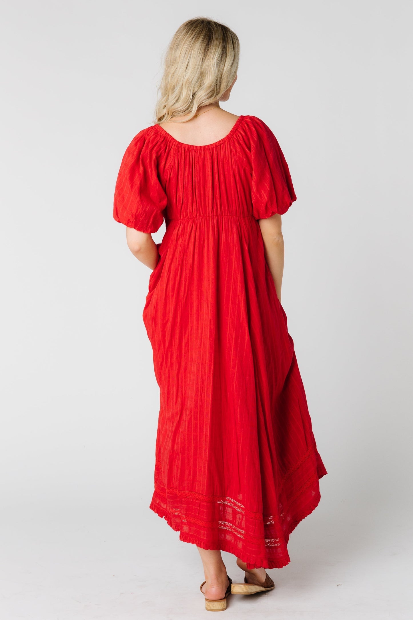 Back view of a woman wearing a re loose fitting maxi dress