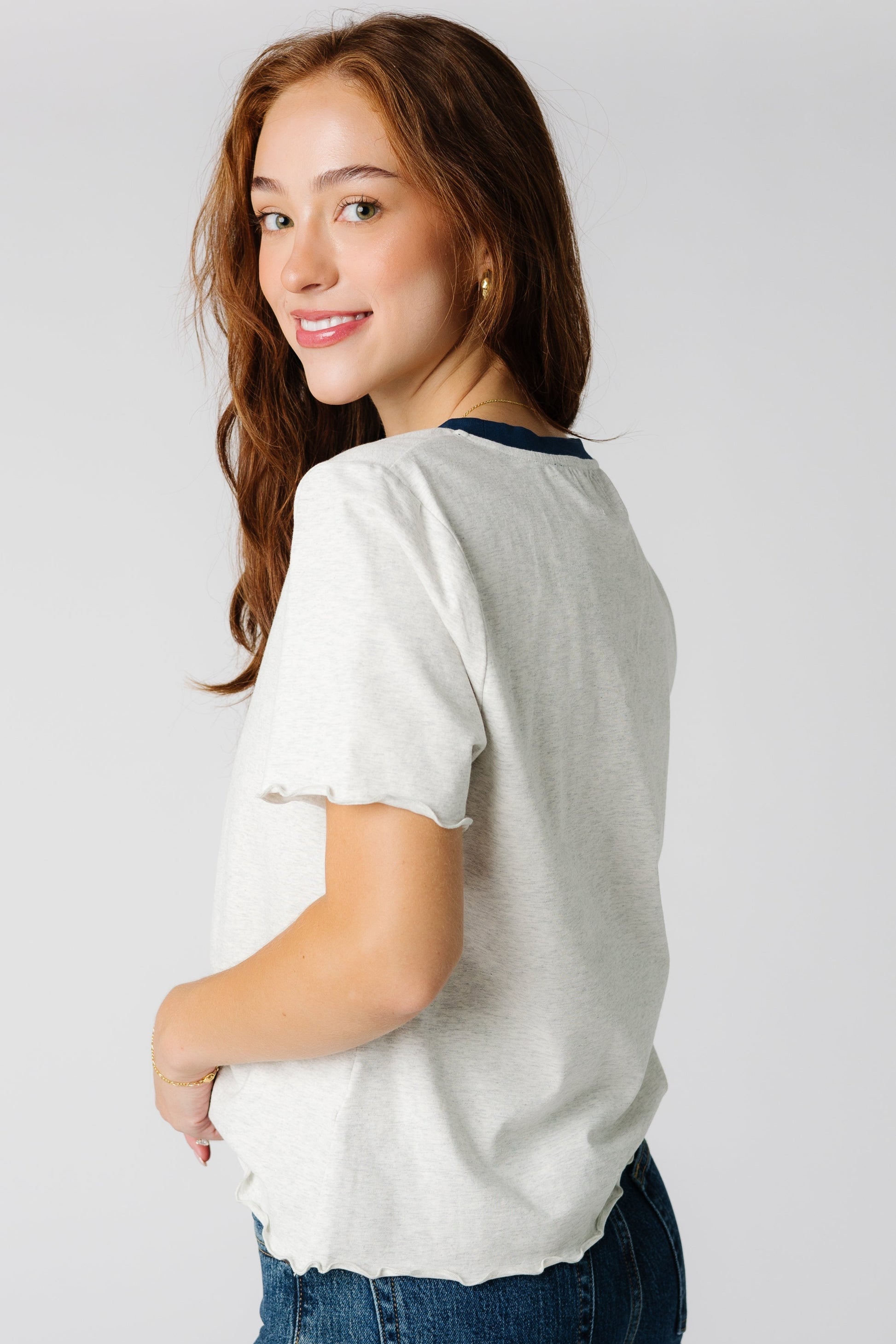 Side view of short sleeve tee with curly hems