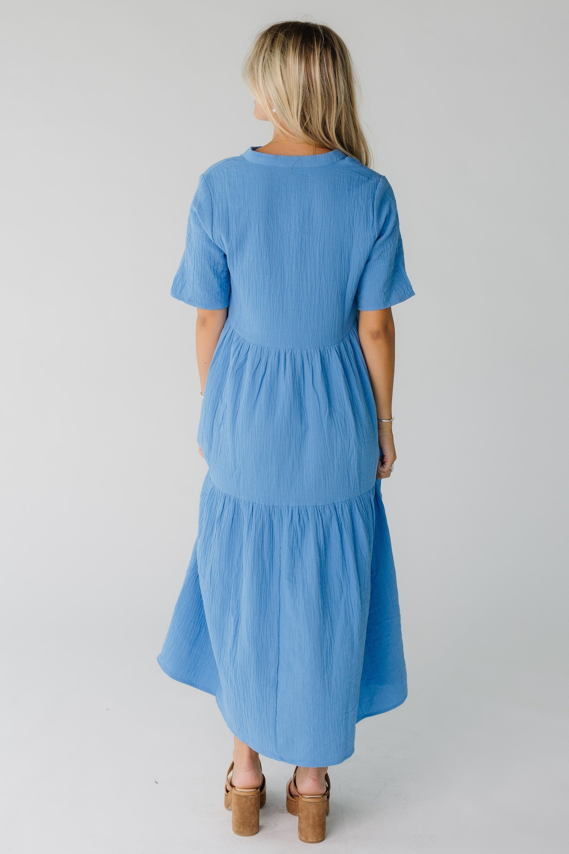 Back view of blue midi dress with short sleeves