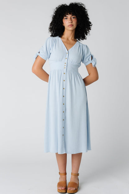 Light blue woven midi with V-neckline and button down dress