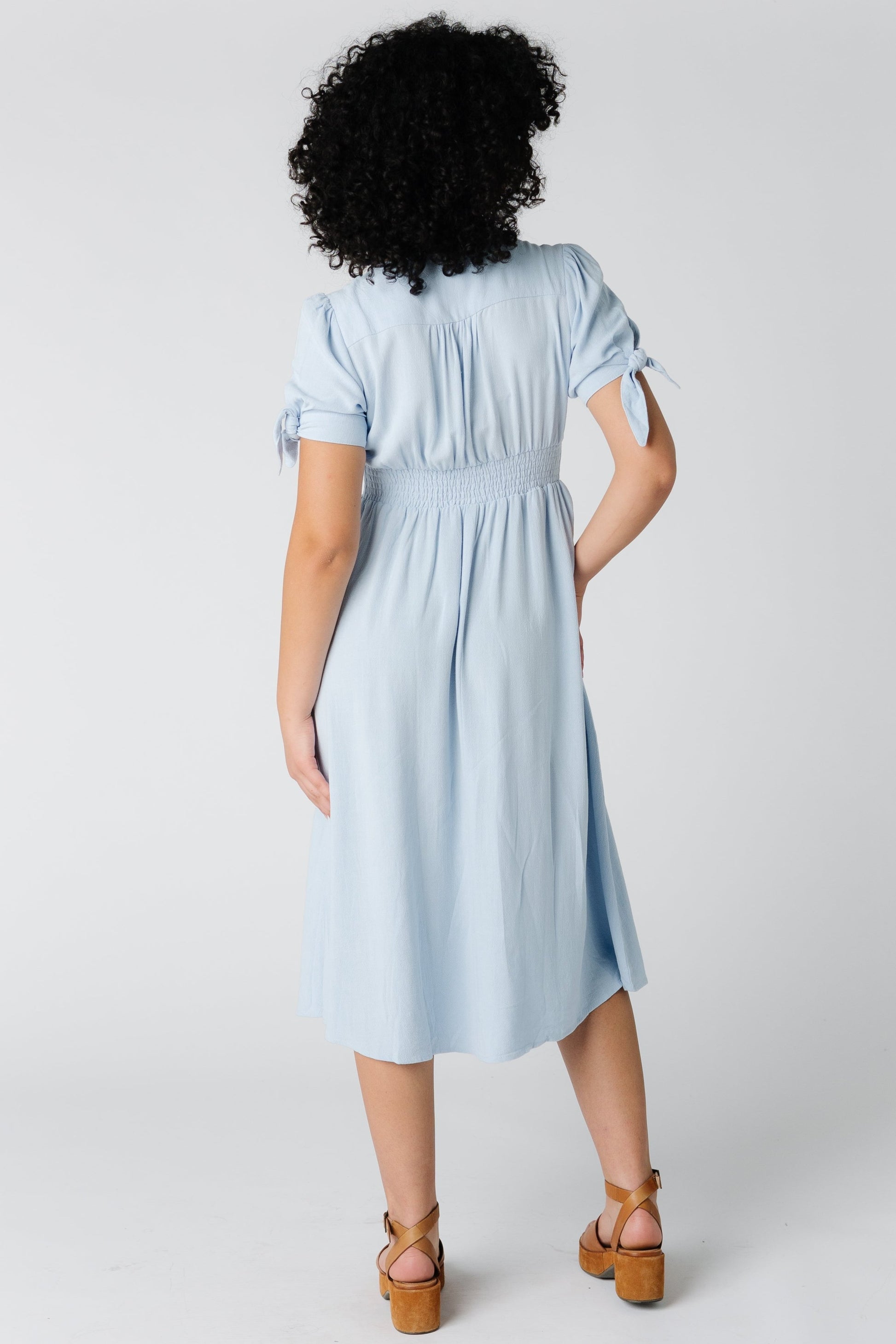 Back view of light blue woven midi dress